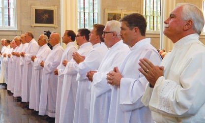 The 15 men who were ordained deacons Aug. 25 at the Cathedral of the Assumption presented themselves to the archbishop during the Rite of Ordination. More photos from the diaconate ordination are online at therecordnewspaper.org.