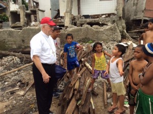 Archbishop Kurtz talks to the children in Tacloban,