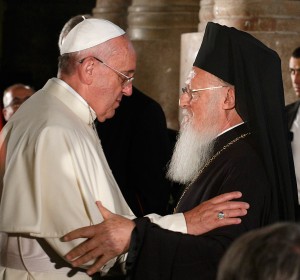 Pope Francis and Ecumenical Patriarch Bartholomew of Constantinople embrace during an ecumenical celebration in the Church of the Holy Sepulcher in Jerusalem May 25. (CNS/Paul Haring)