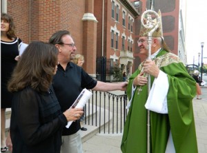 Archbishop greets attendees at the Mass celebrating the 75th anniversary of Catholic Charities at the Cathedral on Sunday, October 28. 