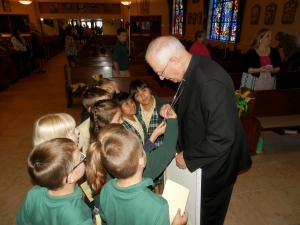 Archbishop Kurtz with students at St. Rita School. St. Rita has increased its overall enrollment as well as its enrollment of Hispanic students over the last two years. 